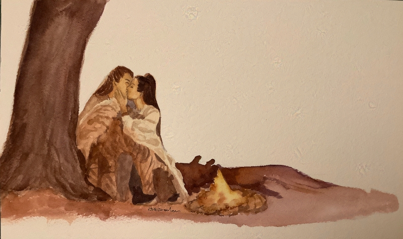 man and woman kissing at a campfire